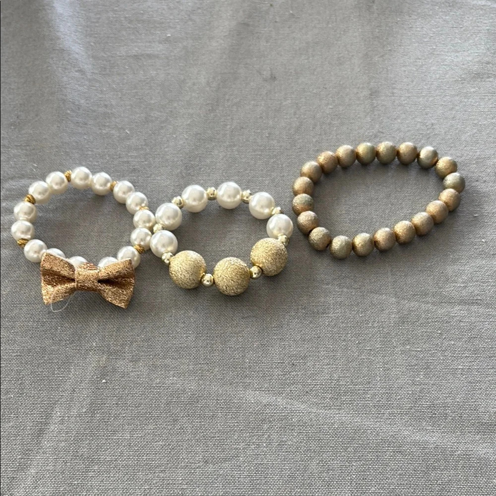 Gold and Cream Jewelry Set with Elegant Bow Charm